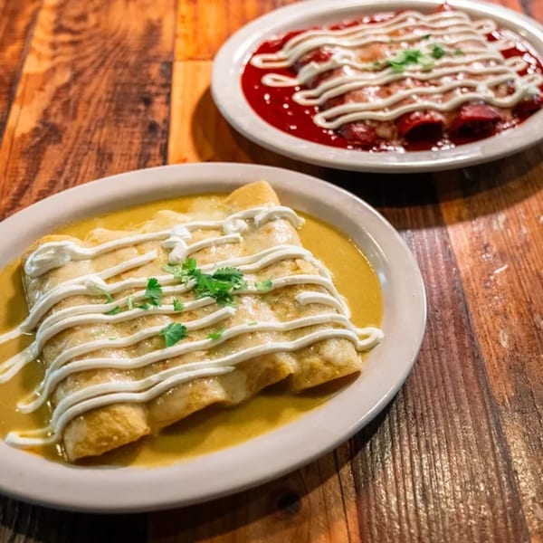 Two plates of El Paisa Cocina Mexicana enchiladas, one with red sauce and one with green sauce.